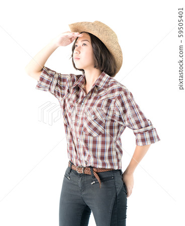 Young woman in a cowboy hat and plaid shirt Young woman in a cowboy hat and plaid shirt 59505401