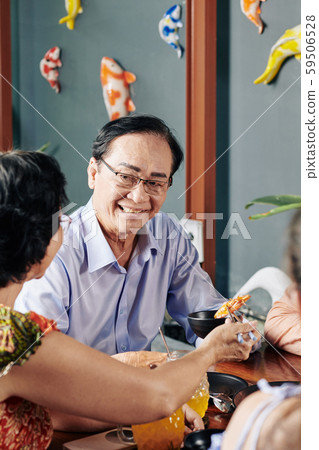 Senior people eating in restaurant 59506528
