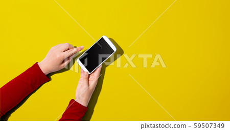 Person using a white smartphone 59507349