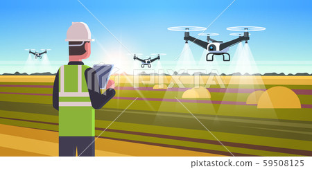 farmer using drone sprayer quad copter flying to spray fertilizer on field smart farming modern 59508125