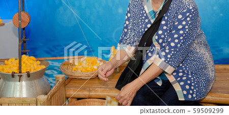 old woman & yellow silkworm cocoon shell for 59509299