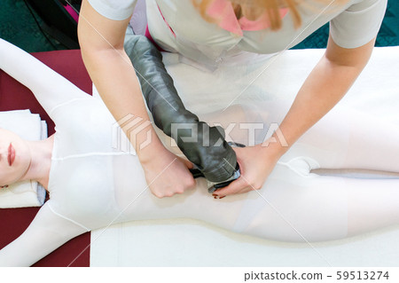 Body massage by LPG therapy apparatus. LPG belly massage girls. Body massage by LPG therapy apparatus. LPG belly massage girls. 59513274