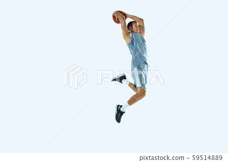 Young caucasian basketball player against white studio background 59514889