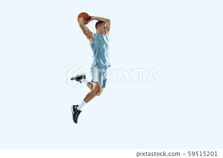Young caucasian basketball player against white studio background 59515201