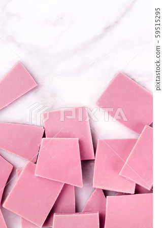 Ruby chocolate, shot from the top on a white marble background with a place for text Ruby chocolate, shot from the top on a white marble background with a place for text 59515295