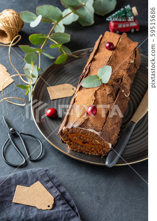 Buche de Noel. Traditional Christmas dessert, Christmas yule log cake with chocolate cream 59515686