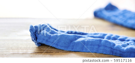 Undressed blue pants on a wooden table 59517116