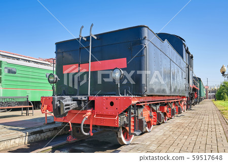 An old black wagon for coal and firewood, close-up An old black wagon for coal and firewood, close-up 59517648