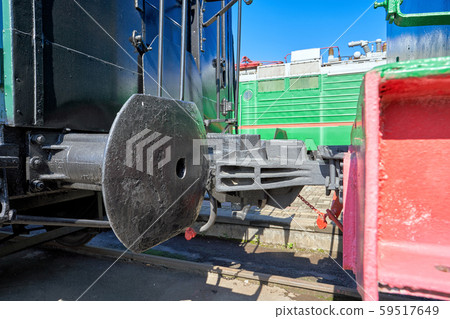 Close-up buffer and railway hitch of a car with a Close-up buffer and railway hitch of a car with a 59517649