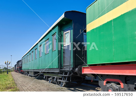 An old passenger railway car stands on rails An old passenger railway car stands on rails 59517650