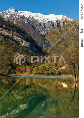 Lago di Tenno Trentino Italy - Beautiful lake with reflections in Italian Alps Lago di Tenno Trentino Italy - Beautiful lake with reflections in Italian Alps 59517902