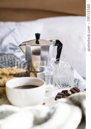 Black coffee in white cup in bed 59518389