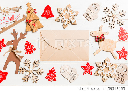 Top view of envelope on festive wooden background. Top view of envelope on festive wooden background. 59518465