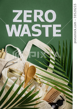 Zero waste concept. Cotton bag, bamboo cultery, glass jar, bamboo toothbrushes, hairbrush and straws Zero waste concept. Cotton bag, bamboo cultery, glass jar, bamboo toothbrushes, hairbrush and straws 59520215