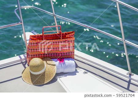 White towel with hat and bag on summer boat. Free space for your decoration. 59521704