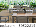 wooden and metal tables and chairs with garden. 59522815