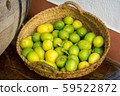 Pile of fresh green yellow limes at market  in 59522872