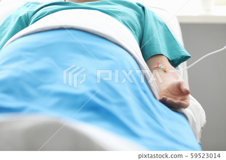 Man with IV in hospital 59523014