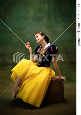 Young ballet dancer as a Snow White with poisoned apple in forest Young ballet dancer as a Snow White with poisoned apple in forest 59524254