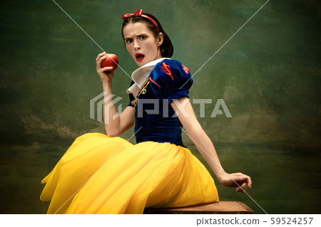 Young ballet dancer as a Snow White with poisoned apple in forest Young ballet dancer as a Snow White with poisoned apple in forest 59524257
