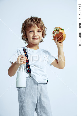 Pretty young boy in casual clothes on white studio background 59528751