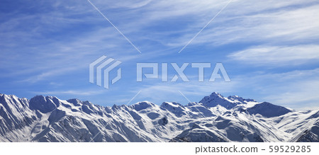 Sunlight snowy mountains in wind day 59529285