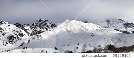 Ski resort and sunlight mountains in clouds Ski resort and sunlight mountains in clouds 59529305