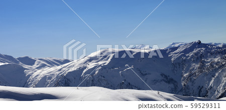 Off-piste slope and blue clear sky in sun morning Off-piste slope and blue clear sky in sun morning 59529311