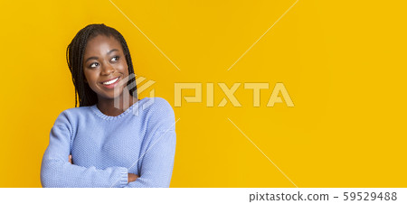 Beautiful afro lady looking with interest at copy space 59529488