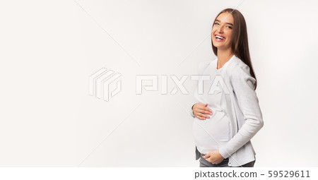 Pregnant Girl Touching Belly And Smiling Over White Background, Panorama 59529611