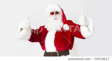 Santa showing thumbs up and greeting warm countries on white Santa showing thumbs up and greeting warm countries on white 59529617