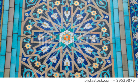 Blue arabesque design inside an old mosque. 59529879