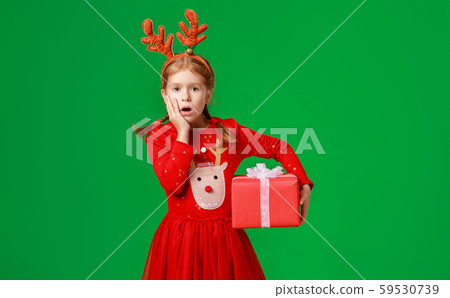 surprised funny child girl in Christmas reindeer surprised funny child girl in Christmas reindeer 59530739