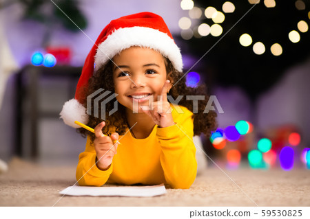 Cute african girl has great thought about Christmas gift Cute african girl has great thought about Christmas gift 59530825
