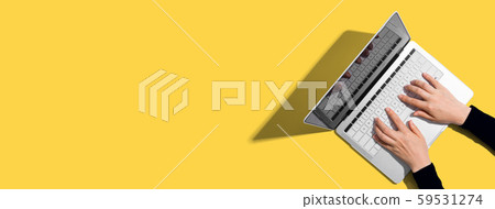 Person using a laptop computer 59531274