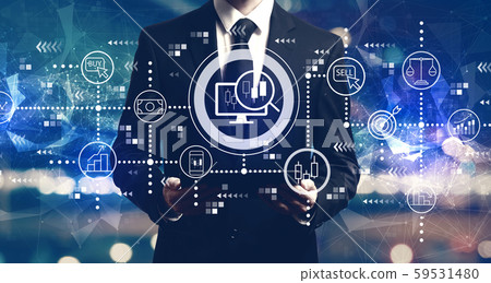 Stock trading theme with businessman holding a tablet 59531480