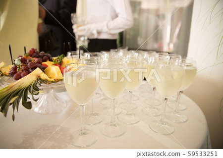 Glasses of champagne on the table. Celebration of wedding Glasses of champagne on the table. Celebration of wedding 59533251