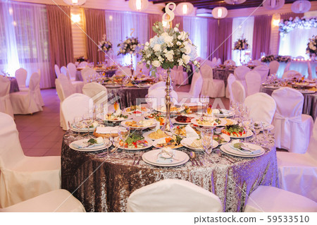 Element of decor in restaurant. Decoration on wedding. A chic tables in restaurant 59533510