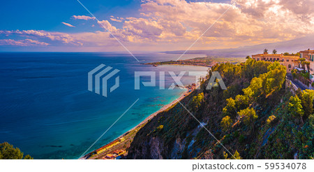 A panoramic view of Taormina, Giardini Naxos and A panoramic view of Taormina, Giardini Naxos and 59534078