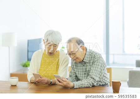 Senior couple smartphone Senior couple smartphone 59535583