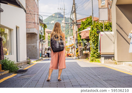 Young woman tourist in Bukchon Hanok Village is one of the famous place for Korean traditional 59536210