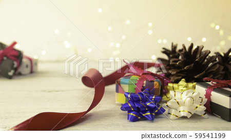 Christmas background: origami gifts and pine cones Christmas background: origami gifts and pine cones 59541199
