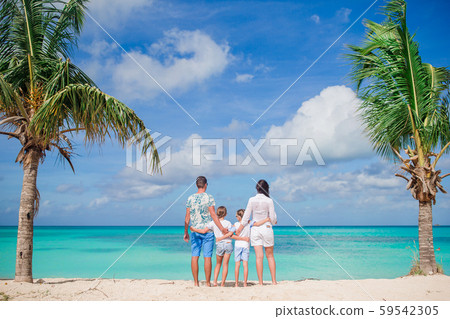 Happy beautiful family with kids on the beach 59542305