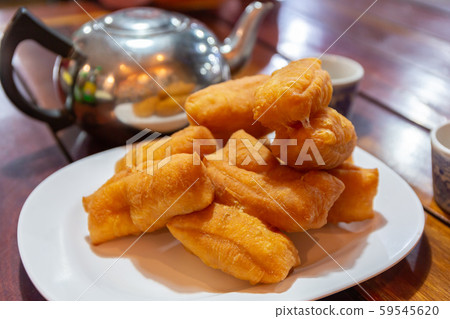 Deep-fried dough stick, Chinese bread stick. 59545620