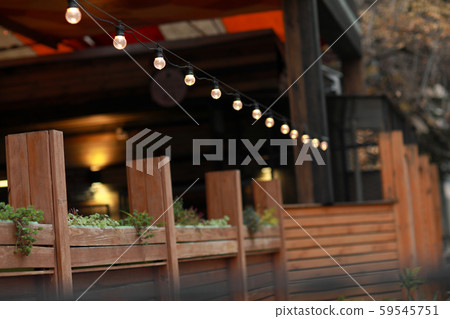 Close-up of a luminous street garland from a lamp of edison 59545751