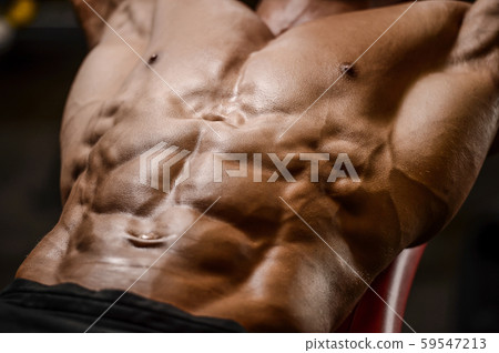 Handsome strong athletic men pumping up muscles 59547213