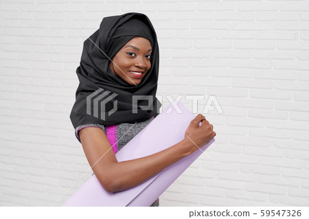 Sslamic girl looking at camera while keeping karemat 59547326