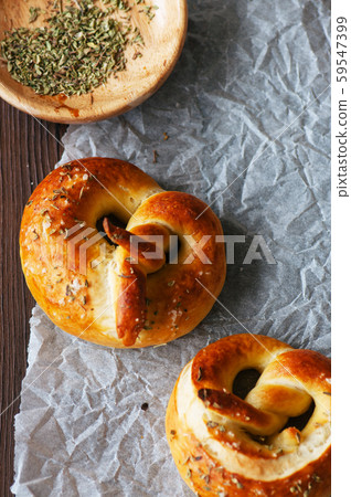 Pretzels with oregano on wooden background. Top 59547399