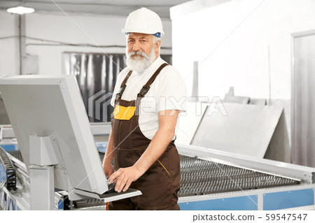 Side view of professional worker of metal factory Side view of professional worker of metal factory 59547547