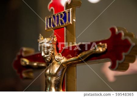 Holy cross made of gold with crucified Jesus Christ with the inscription: INRI Iesus Nazarenus, Rex Holy cross made of gold with crucified Jesus Christ with the inscription: INRI Iesus Nazarenus, Rex 59548365